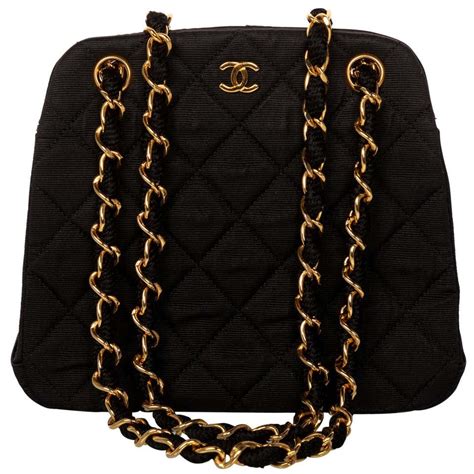 black chanel bag with chain|small black quilted Chanel bag.